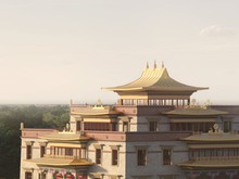 Computer generated image of the golden roof of a Buddhist temple with tree tops and wide open skies in England, UK.