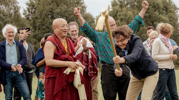 Tibetan Buddhist Meditation Master and group of volunteers breaking ground to build foundations of a Buddhist Temple in the UK.