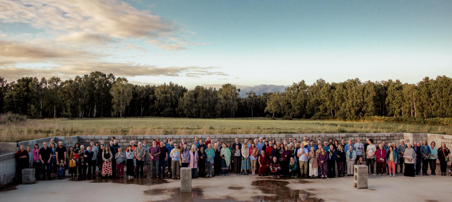 Group photo at Gomde UK, inside the foundations of the new Buddhist Temple in Yorkshire, UK.