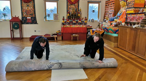 Preparations for seminar on Buddhism in meditation hall.
